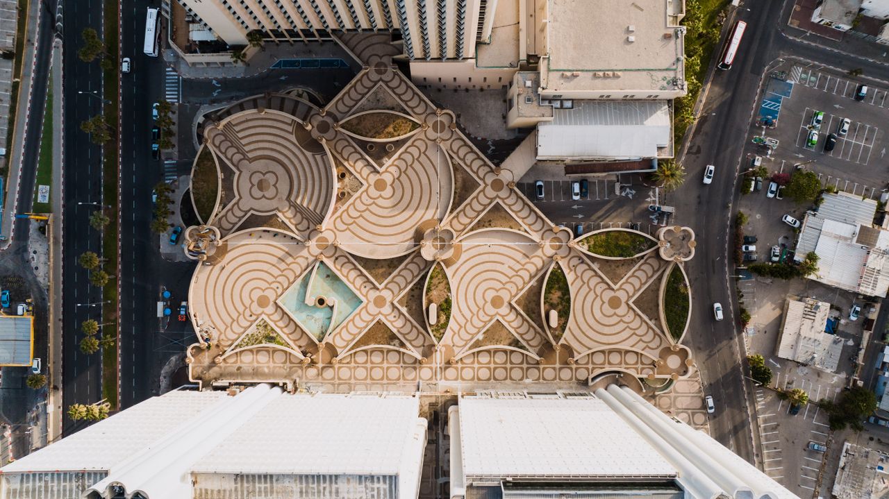 Drone shot capturing unique geometric rooftop patterns in Tel Aviv, Israel.